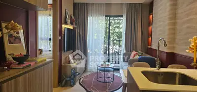 Modern living room with open kitchen, stylish decor, and balcony view in a contemporary apartment.