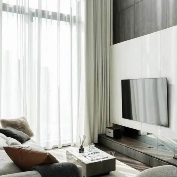 Luxurious modern living room with high ceilings and large windows