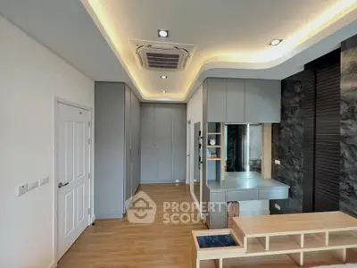 Modern interior with sleek cabinetry and stylish lighting in a contemporary living space.