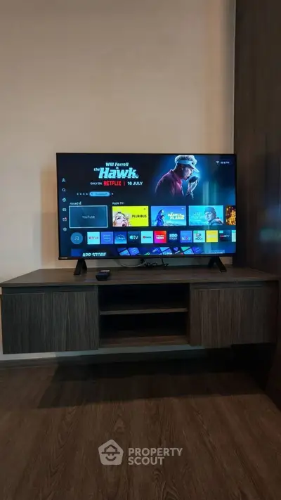 Modern living room with sleek TV setup and stylish wooden cabinet