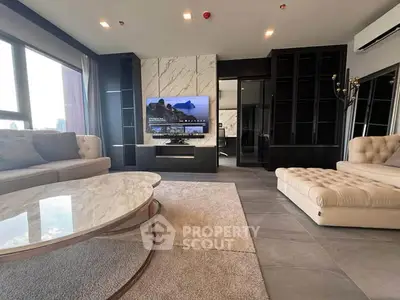 Luxurious modern living room with elegant furniture and large windows offering stunning views.
