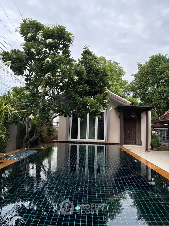 Luxurious private villa with stunning pool and lush greenery
