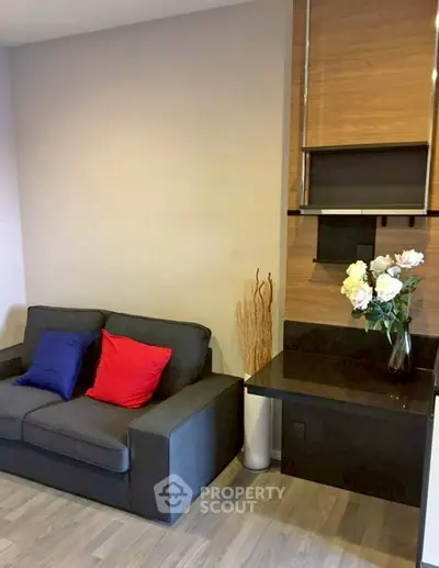 Modern living room with stylish sofa and decorative shelving