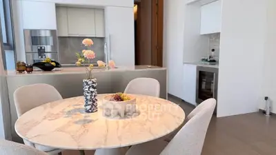 Modern kitchen with elegant dining area and stylish decor