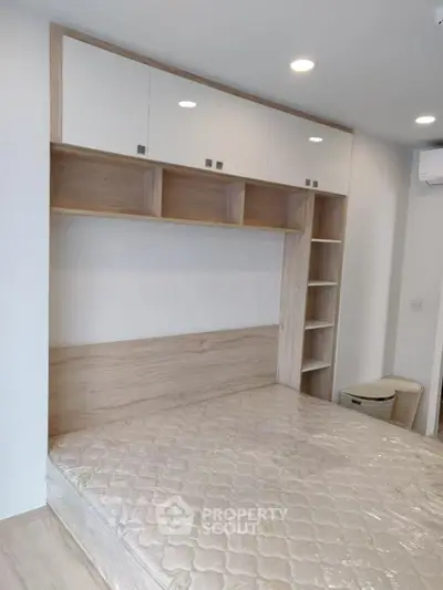 Modern bedroom with built-in storage and minimalist design