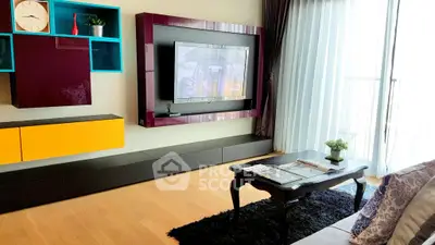 Modern living room with stylish TV unit and natural light