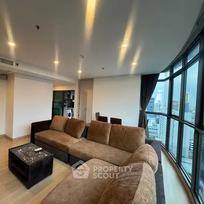 Spacious modern living room with city view and elegant furnishings