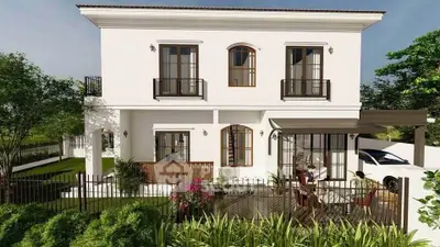 Charming two-story white house with elegant balconies and lush garden, perfect for family living.