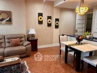 Stylish living room with elegant decor and cozy seating in modern apartment.