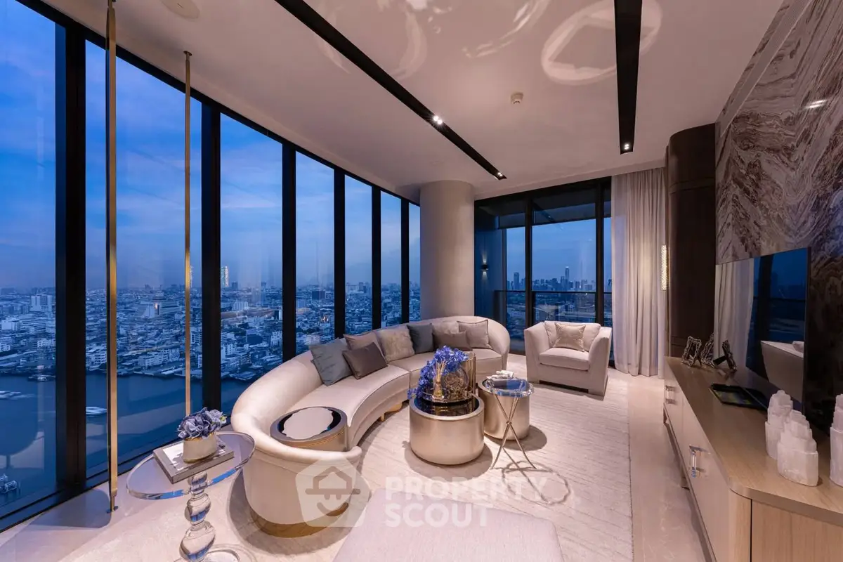 Luxurious high-rise living room with panoramic city views and elegant modern decor.