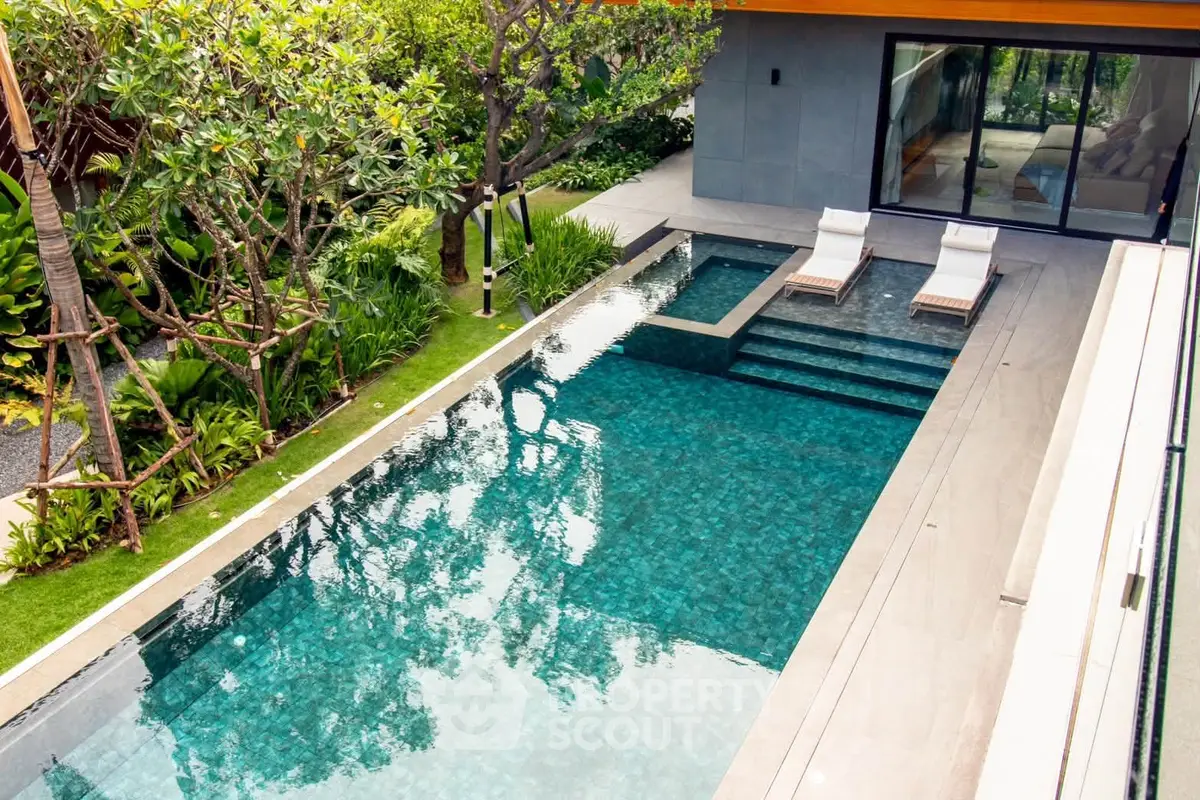 Luxurious modern home with private pool and lush garden, perfect for relaxation and entertainment.