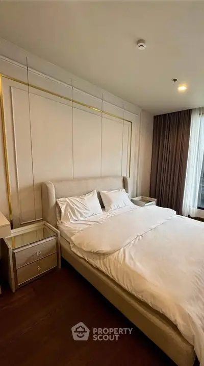 Luxurious bedroom with elegant decor and plush bedding in modern apartment