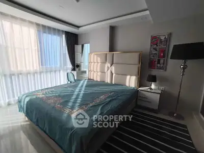 Modern bedroom with large window and stylish decor