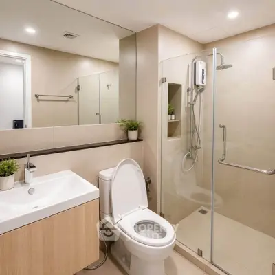 Modern bathroom with glass shower and sleek fixtures