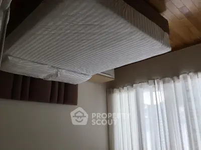 Cozy bedroom with natural light and modern decor