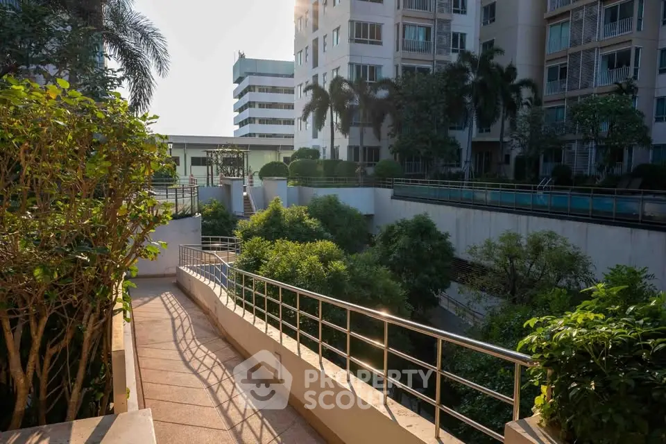 Luxurious residential complex with lush greenery and modern architecture