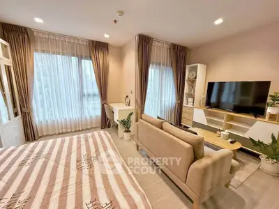 Spacious modern living room with large windows and stylish decor