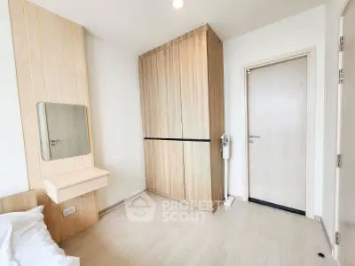 Modern minimalist bedroom with wooden wardrobe and sleek design