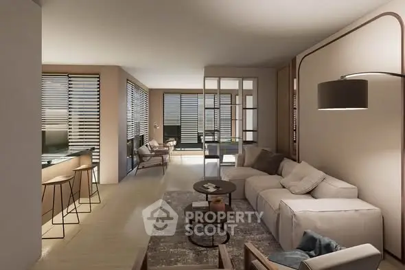 Modern living room with stylish decor and open layout, featuring large windows and cozy seating area.