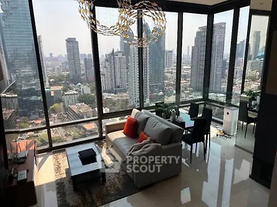 Luxurious high-rise living room with stunning cityscape views and modern furnishings.