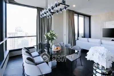 Luxurious modern living room with panoramic city views and elegant dining area.