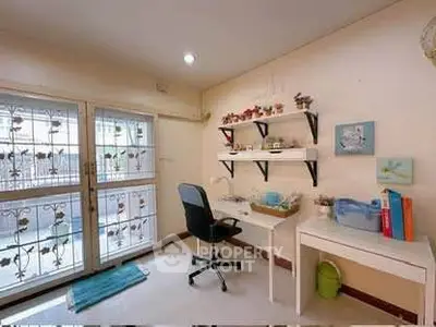 Charming study room with natural light and modern decor, perfect for productivity and creativity.