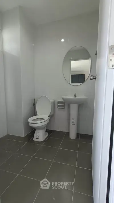 Modern bathroom with sleek fixtures and minimalist design.
