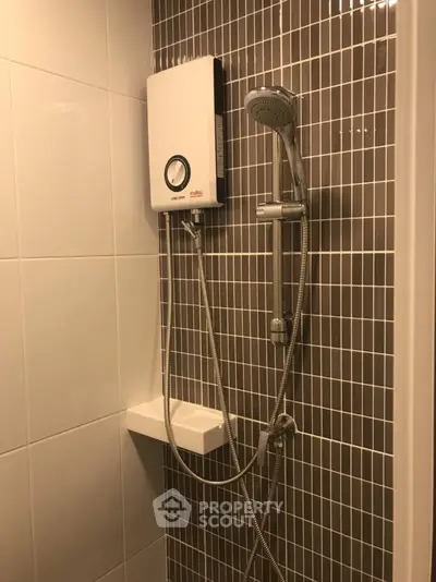 Modern bathroom with sleek shower design and stylish tile work.