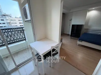 Modern studio apartment with balcony and stylish interior design