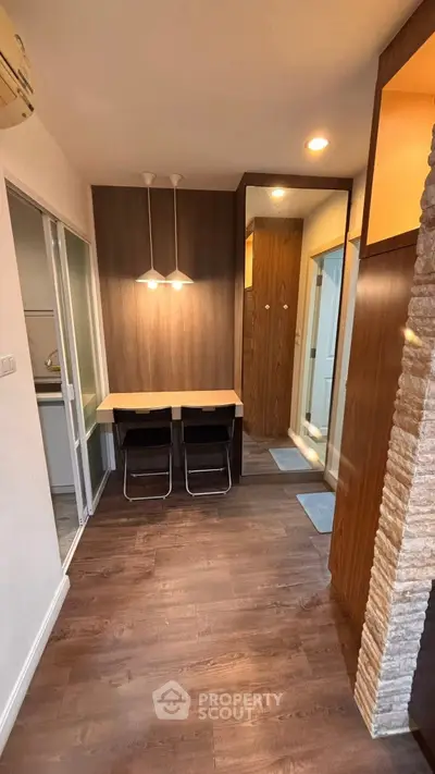 Modern apartment interior with stylish dining area and wooden flooring