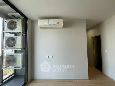 Modern apartment interior with air conditioning and outdoor unit view