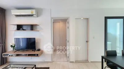 Modern living room with sleek furniture and air conditioning, perfect for comfortable living.