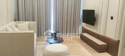 Modern living room with sleek furniture and wall-mounted TV, perfect for cozy relaxation.