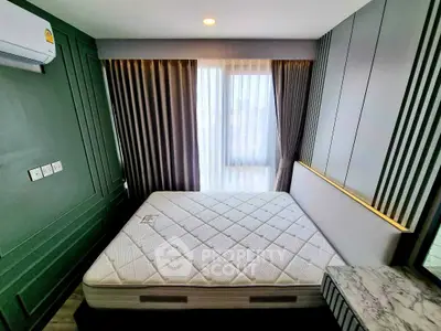 Modern bedroom with stylish decor and large window for natural light