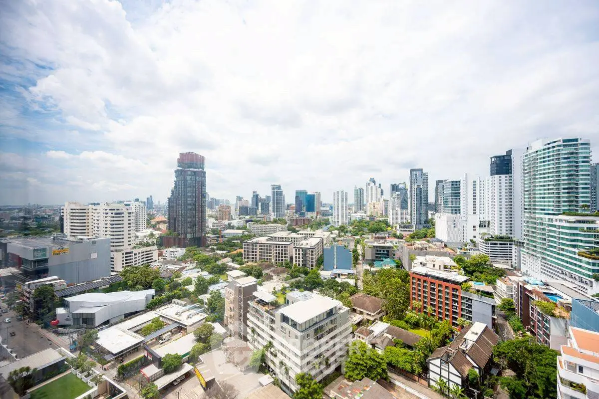 Stunning cityscape view showcasing modern skyscrapers and lush greenery, perfect for urban living enthusiasts.
