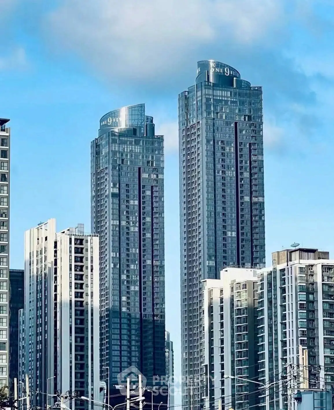 Stunning high-rise buildings with modern architecture against a clear blue sky.