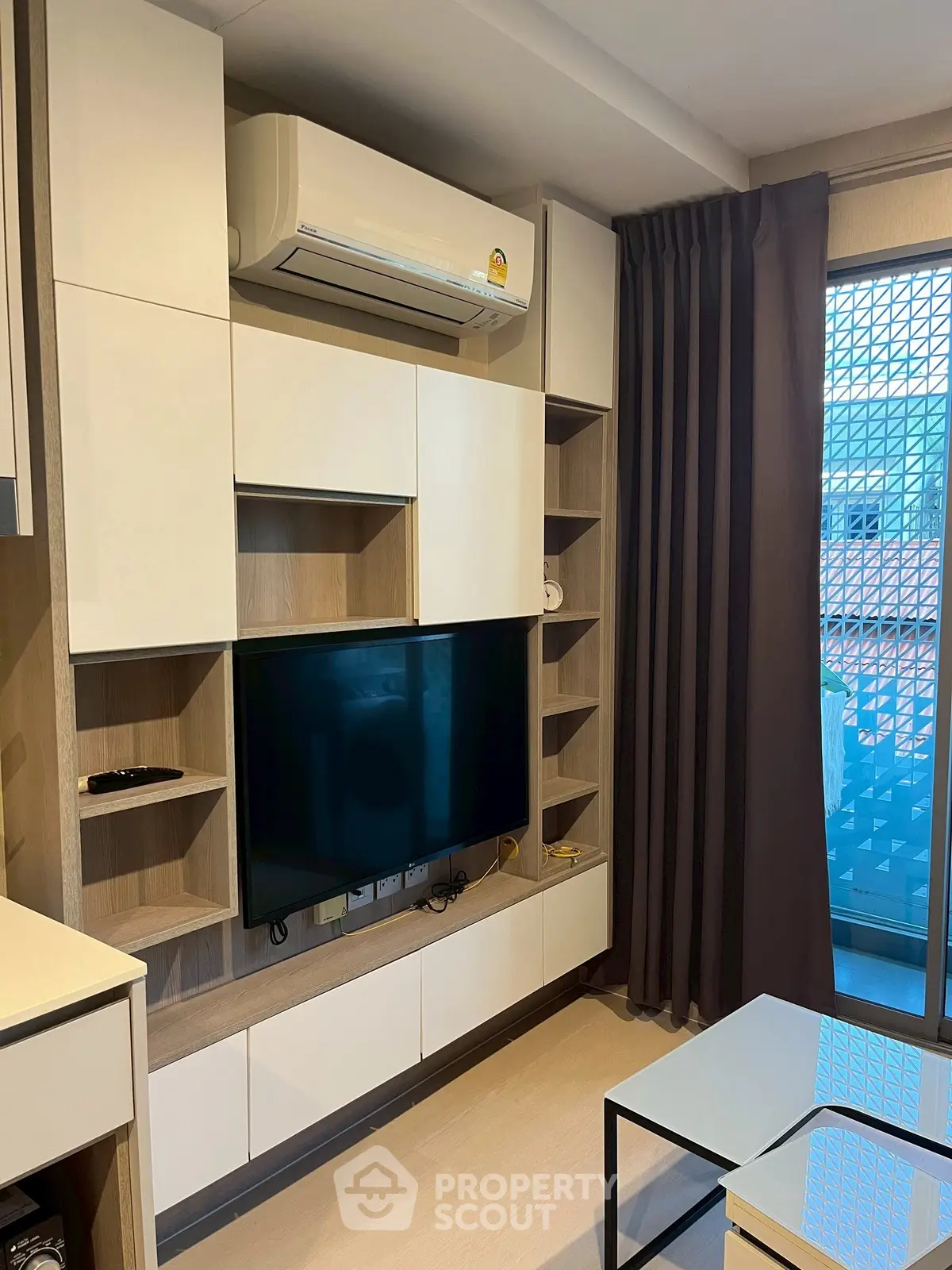 Modern living room with built-in TV unit and air conditioning