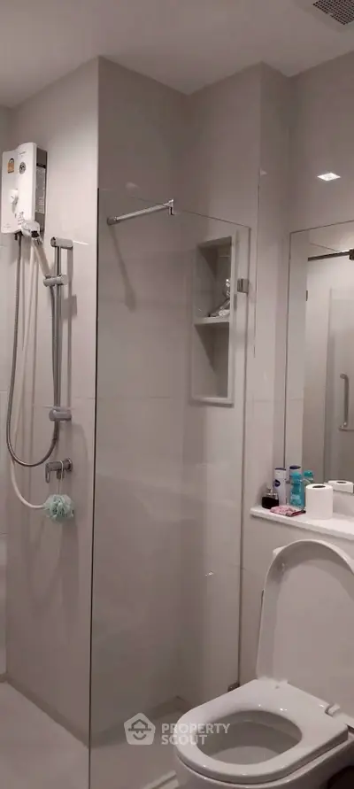 Modern bathroom with sleek shower and toilet design