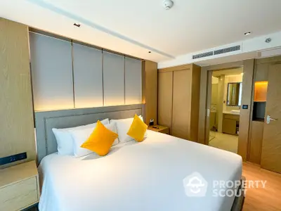 Luxurious bedroom with modern design and ensuite bathroom in upscale apartment