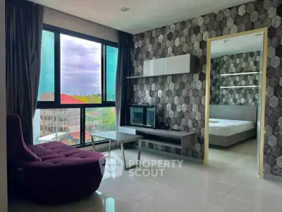 Modern living room with stylish decor and bedroom view in a contemporary apartment.