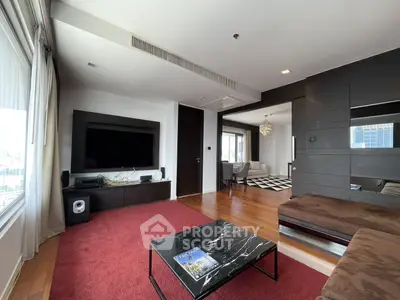 Spacious modern living room with large TV and stylish decor