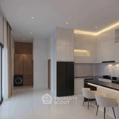 Modern kitchen with sleek cabinetry and integrated appliances in a stylish open layout.