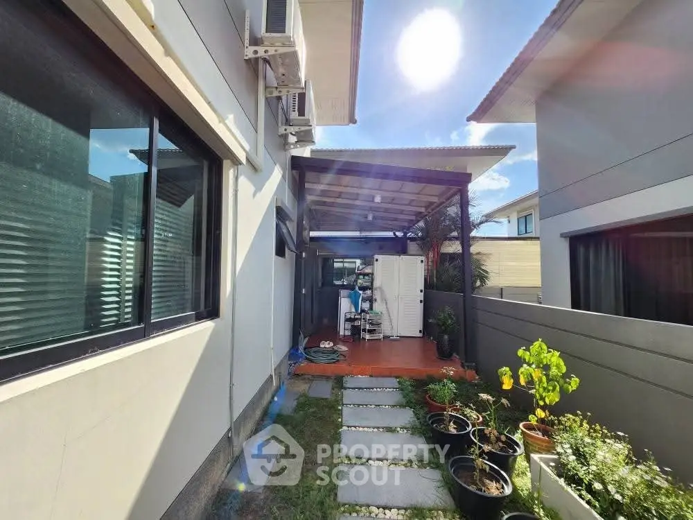 Charming backyard space with modern design and lush greenery, perfect for relaxation and outdoor activities.