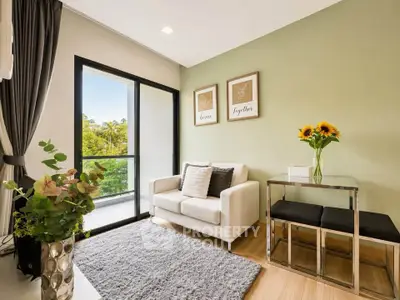 Charming living room with cozy sofa, elegant decor, and lush garden view from balcony.