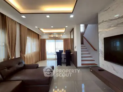 Luxurious modern living room with elegant lighting and stylish staircase