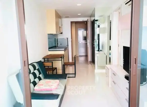 Modern living room with open layout and stylish furniture in a cozy apartment.