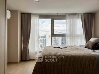 Luxurious bedroom with stunning city view and elegant decor