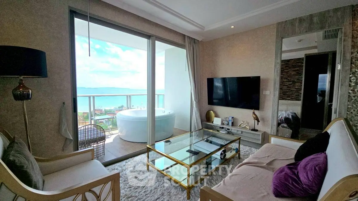 Luxurious living room with balcony and stunning ocean view