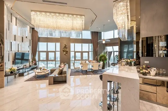Luxurious open-plan living room with stunning city views and elegant chandeliers.