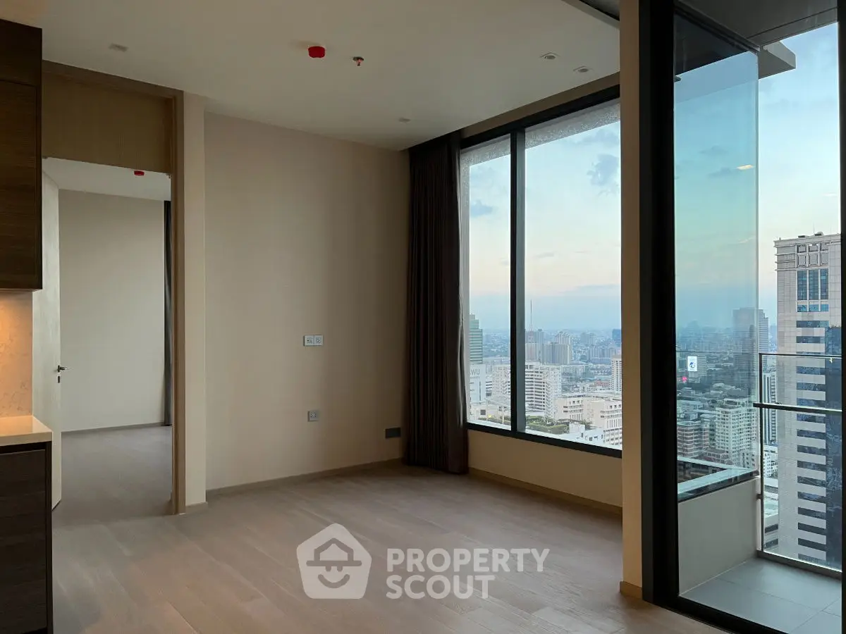 Modern high-rise apartment with stunning city view and floor-to-ceiling windows